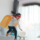 Child playing superhero at home, building confidence through imaginative play